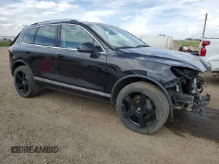 2015 Volkswagen Touareg Sport z VIN WVGEF9BP3FD004771, wystawiony jako Copart lot #58668125 z przebiegiem 64 422 mil mil oraz Czysty tytuł • Clean title. Historia ofert i sprzedaży dostępna na DreamBid. Obrazek 4.