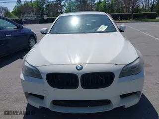 2013 BMW M5 with VIN WBSFV9C58DC773268, listed as a IAAI auction lot 41890830 with 128,399 mi miles. Bid and sale history available at carsss.com. Image 6.