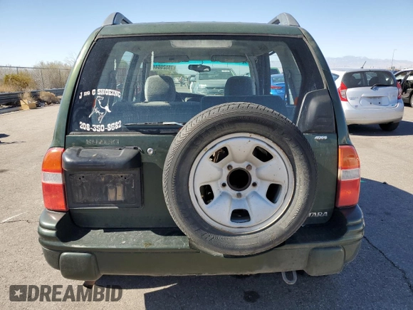 2000 Suzuki Vitara JX z VIN 2S3TD52V1Y6108459, wystawiony jako Copart lot #75526644 z przebiegiem 263 433 mil mil oraz Szkody całkowita. Historia ofert i sprzedaży dostępna na DreamBid. Obrazek 6.