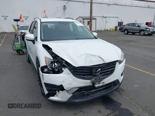 2016 Mazda CX-5 Sport with VIN JM3KE4BY7G0764563, listed as a IAAI auction lot 42279993 with 128,950 mi miles and . Bid and sale history available at DreamBid. Image 6.