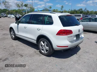 2012 Volkswagen Touareg Sport with VIN WVGEF9BP1CD008717, listed as a IAAI auction lot 42120641 with 211,580 mi miles and . Bid and sale history available at DreamBid. Image 3.