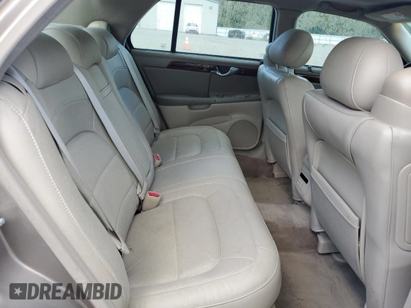 2004 Cadillac DeVille DTS z VIN 1G6KF579X4U212415, wystawiony jako Copart lot #58005555 z przebiegiem 97 663 mil mil oraz Tytuł czysty. Historia ofert i sprzedaży dostępna na DreamBid. Obrazek 10.