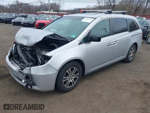 2013 Honda Odyssey EX-L with VIN 5FNRL5H65DB050789, listed as a IAAI auction lot 41911537 with 160,348 mi miles and . Bid and sale history available at carsss.com. Image 18.