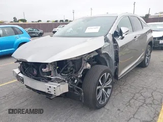 2021 Lexus RX 450h with VIN 2T2HGMDA3MC060208, listed as a IAAI auction lot 42163455 with 34,167 mi miles and . Bid and sale history available at DreamBid. Image 2.