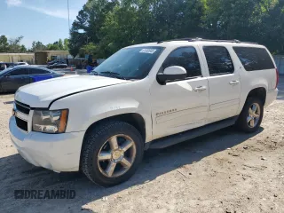 2013 Chevrolet Suburban LT with VIN 1GNSKJE79DR312308, listed as a Copart auction lot 61052045 with 212,689 mi miles and Salvage title. Bid and sale history available at DreamBid. Image 1.