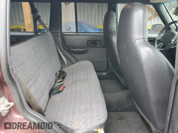 2000 Jeep Cherokee with VIN 1J4FF48SXYL198290, listed as a Copart auction lot 66026705 with 201,409 mi miles and Clean title. Bid and sale history available at DreamBid. Image 10.