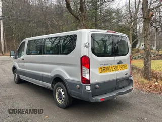 2015 Ford Transit Passenger XL with VIN 1FBZX2YGXFKA96110, listed as a Copart auction lot 84711064 with 169,835 mi miles and Clean Title. Bid and sale history available at DreamBid. Image 3.