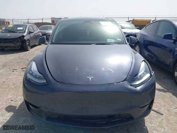 2023 Tesla Model Y Long Range with VIN 7SAYGDEE5PA035722, listed as a IAAI auction lot 41726067 with 34,357 mi miles. Bid and sale history available at carsss.com. Image 12.