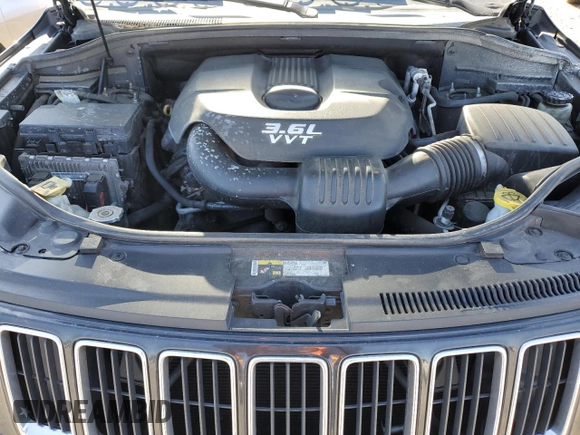 2014 Jeep Grand Cherokee Laredo with VIN 1C4RJFAG4EC210321, listed as a Copart auction lot 53574595 with 119,650 mi miles and Salvage Title. Bid and sale history available at DreamBid. Image 12.