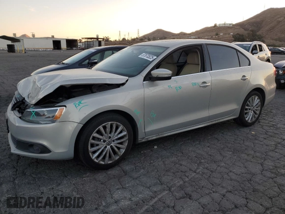 2012 Volkswagen Jetta Sedan SEL w/Sunroof with VIN 3VWLX7AJ7CM310458, listed as a Copart auction lot 87670525 with 142,944 mi miles and Salvage Title. Bid and sale history available at carsss.com. Image 1.