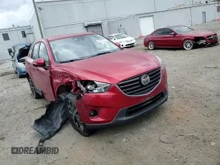 2016 Mazda CX-5 Grand Touring with VIN JM3KE4DY0G0664379, listed as a Copart auction lot 54659005 with 116,022 mi miles and Salvage Title. Bid and sale history available at DreamBid. Image 14.