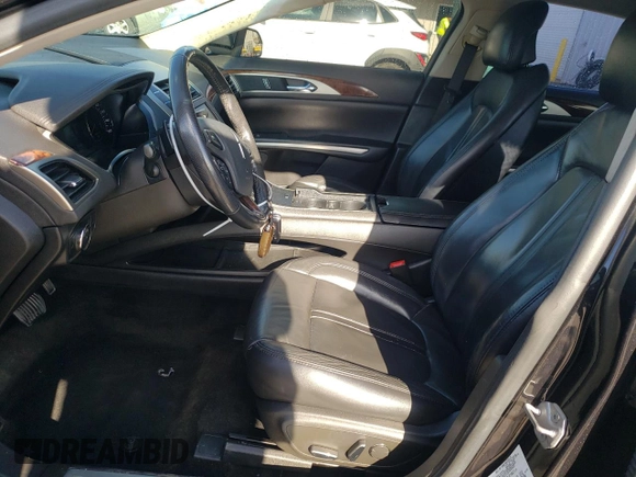 2014 Lincoln MKZ z VIN 3LN6L2GK3ER802789, wystawiony jako Copart lot #86357034 z przebiegiem 215 548 mil mil oraz Szkoda całkowita • Salvage title. Historia ofert i sprzedaży dostępna na DreamBid. Obrazek 7.