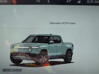 2022 Rivian R1T Adventure Package with VIN 7FCTGAAA5NN007018, listed as a IAAI auction lot 42018939 with 41,991 mi miles. Bid and sale history available at carsss.com. Image 7.