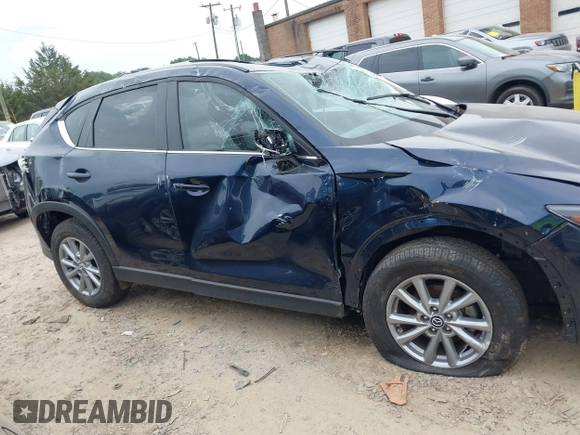 2023 Mazda CX-5 S Carbon Edition z VIN JM3KFBCM6P0251947, wystawiony jako IAAI lot #42286595 z przebiegiem 9 434 mil mil oraz . Historia ofert i sprzedaży dostępna na DreamBid. Obrazek 13.