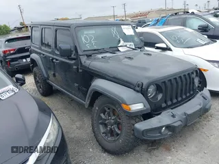 2021 Jeep Wrangler Unlimited Sport S with VIN 1C4HJXDG0MW694045, listed as a IAAI auction lot 41145659 with 56,520 mi miles. Bid and sale history available at carsss.com. Image 1.