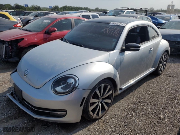 2012 Volkswagen Beetle 2.0T Turbo w/Sun/Sound PZEV with VIN 3VWVA7AT7CM664802, listed as a Copart auction lot 64850314 with 102,107 mi miles and Salvage Title. Bid and sale history available at carsss.com. Image 1.