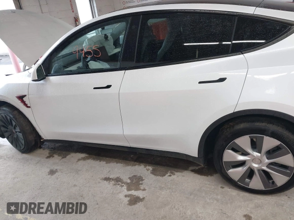 2023 Tesla Model Y Long Range with VIN 7SAYGDEE7PA100523, listed as a IAAI auction lot 40399455 with 18,885 mi miles and . Bid and sale history available at DreamBid. Image 14.