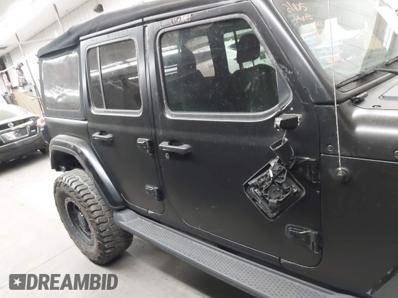 2018 Jeep Wrangler Unlimited Sahara z VIN 1C4HJXEN6JW294774, wystawiony jako IAAI lot #41573606 z przebiegiem 49 325 mil mil oraz . Historia ofert i sprzedaży dostępna na DreamBid. Obrazek 14.