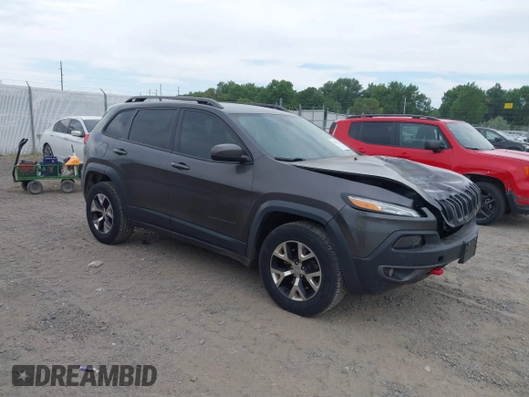 2015 Jeep Cherokee Trailhawk with VIN 1C4PJMBSXFW654754, listed as a IAAI auction lot 39935278 with 128,076 mi miles and . Bid and sale history available at DreamBid. Image 1.