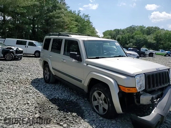 2007 Jeep Commander Sport z VIN 1J8HG48K67C651209, wystawiony jako Copart lot #64049035 z przebiegiem 216 628 mil mil oraz Szkoda całkowita • Salvage title. Historia ofert i sprzedaży dostępna na DreamBid. Obrazek 14.
