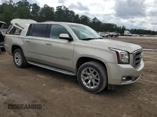 2015 GMC Yukon XL SLT with VIN 1GKS1HKC5FR168608, listed as a Copart auction lot 71564384 with 197,538 mi miles and Salvage Title. Bid and sale history available at carsss.com. Image 4.