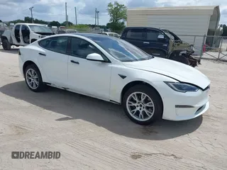 2022 Tesla Model S Plaid with VIN 5YJSA1E6XNF473888, listed as a IAAI auction lot 42141141 with 28,584 mi miles and . Bid and sale history available at carsss.com. Image 1.