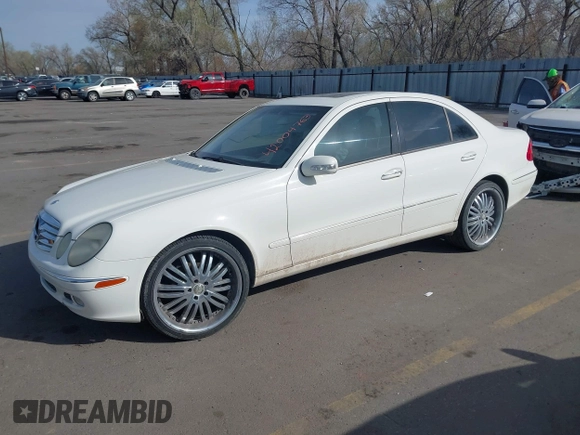 2003 Mercedes-Benz E-Class 3.2L with VIN WDBUF65J63A233107, listed as a IAAI auction lot 42004763 with 151,327 mi miles. Bid and sale history available at carsss.com. Image 2.