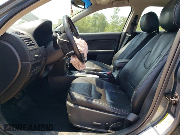 2012 Ford Fusion SEL z VIN 3FAHP0JG7CR332022, wystawiony jako Copart lot #60785765 z przebiegiem 112 202 mil mil oraz Szkoda całkowita • Salvage title. Historia ofert i sprzedaży dostępna na DreamBid. Obrazek 7.