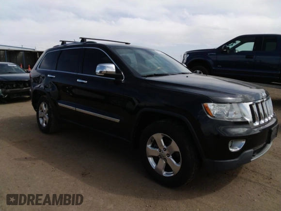 2013 Jeep Grand Cherokee Overland with VIN 1C4RJFCG5DC638927, listed as a Copart auction lot 52752615 with 117,494 mi miles and Salvage Title. Bid and sale history available at carsss.com. Image 4.