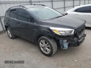 2017 Ford Escape SE with VIN 1FMCU0GD7HUE72044, listed as a Copart auction lot 48565255 with 125,052 mi miles and Salvage Title. Bid and sale history available at DreamBid. Image 4.