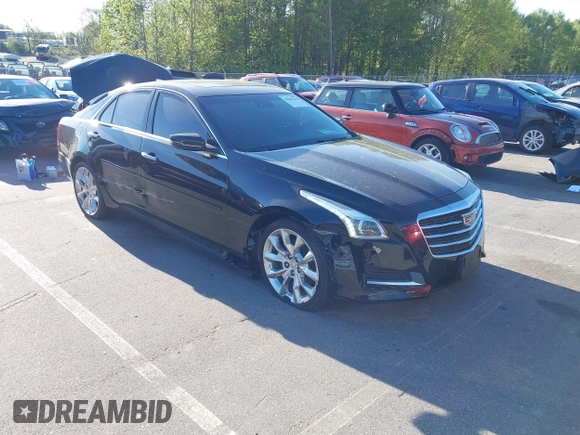 2015 Cadillac CTS Premium AWD with VIN 1G6AZ5S35F0129572, listed as a IAAI auction lot 42045670 with 62,758 mi miles and . Bid and sale history available at DreamBid. Image 1.