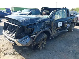 2021 Nissan Titan Pro-4X with VIN 1N6AA1ED4MN515673, listed as a IAAI auction lot 42028678 with 128,719 mi miles and . Bid and sale history available at DreamBid. Image 2.