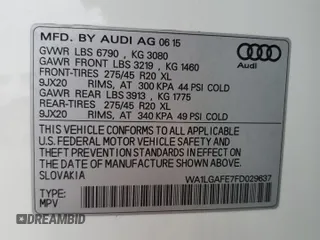 2015 Audi Q7 Premium Plus with VIN WA1LGAFE7FD029637, listed as a Copart auction lot 56596535 with 131,381 mi miles and Salvage Title. Bid and sale history available at DreamBid. Image 13.
