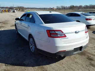 2014 Ford Taurus Limited with VIN 1FAHP2F89EG155934, listed as a IAAI auction lot 41760703 with 130,280 mi miles. Bid and sale history available at carsss.com. Image 3.