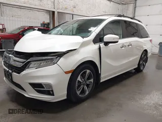 2019 Honda Odyssey Touring with VIN 5FNRL6H8XKB079113, listed as a IAAI auction lot 42359455 with 74,545 mi miles and . Bid and sale history available at DreamBid. Image 2.