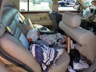 1995 Cadillac DeVille z VIN 1G6KD52B6SU274827, wystawiony jako Copart lot #41902125 z przebiegiem Nie podano mil oraz Szkoda całkowita • Salvage title. Historia ofert i sprzedaży dostępna na DreamBid. Obrazek 11.