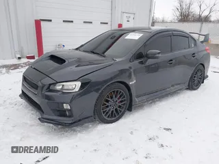 2015 Subaru WRX STI with VIN JF1VA2L60F9803514, listed as a IAAI auction lot 41591735 with 82,700 mi miles and . Bid and sale history available at DreamBid. Image 2.