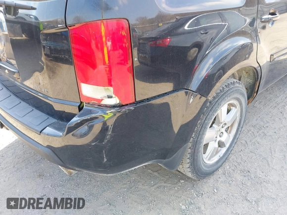 2009 Honda Pilot EX-L with VIN 5FNYF48529B035128, listed as a IAAI auction lot 42006450 with 214,069 mi miles. Bid and sale history available at carsss.com. Image 15.