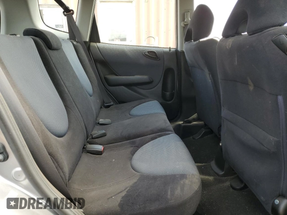 2007 Honda Fit z VIN JHMGD38497S025472, wystawiony jako Copart lot #55901095 z przebiegiem 120 216 mil mil oraz Szkoda całkowita • Salvage title. Historia ofert i sprzedaży dostępna na DreamBid. Obrazek 10.