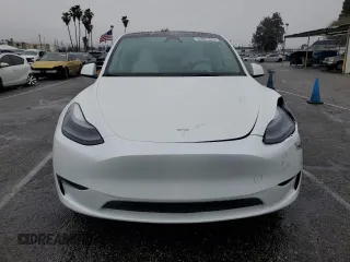 2023 Tesla Model Y Performance with VIN 7SAYGDEF1PF809654, listed as a Copart auction lot 43981915 with 16,401 mi miles and Salvage Title. Bid and sale history available at DreamBid. Image 5.