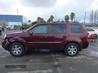 2009 Honda Pilot Touring with VIN 5FNYF48959B007813, listed as a IAAI auction lot 41823645 with 200,571 mi miles and . Bid and sale history available at carsss.com. Image 14.