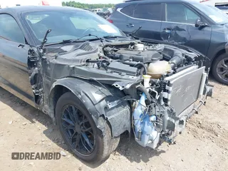 2019 Ford Mustang EcoBoost z VIN 1FA6P8TH0K5199276, wystawiony jako IAAI lot #42491713 z przebiegiem 135 710 mil mil oraz . Historia ofert i sprzedaży dostępna na DreamBid. Obrazek 6.