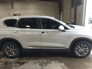 2019 Hyundai Santa Fe SE with VIN 5NMS23AD1KH063472, listed as a IAAI auction lot 41375650 with 64,496 mi miles and . Bid and sale history available at DreamBid. Image 14.