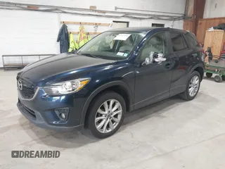 2015 Mazda CX-5 Grand Touring z VIN JM3KE4DYXF0490920, wystawiony jako IAAI lot #42367194 z przebiegiem 80 436 mil mil oraz . Historia ofert i sprzedaży dostępna na DreamBid. Obrazek 2.
