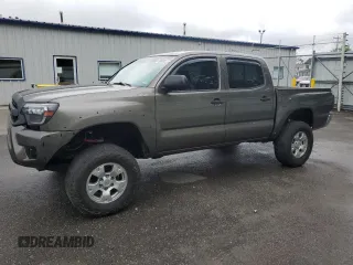 2014 Toyota Tacoma with VIN 3TMLU4EN1EM149115, listed as a Copart auction lot 56849715 with 284,881 mi miles and Salvage title. Bid and sale history available at DreamBid. Image 1.