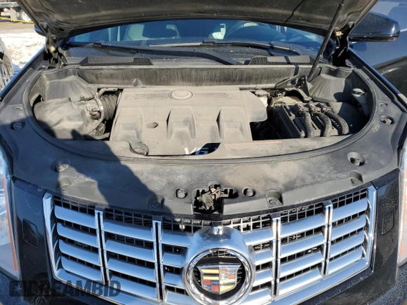 2014 Cadillac SRX Premium Collection z VIN 3GYFNGE38ES577313, wystawiony jako Copart lot #87679045 z przebiegiem 92 070 mil mil oraz Szkoda całkowita • Salvage title. Historia ofert i sprzedaży dostępna na DreamBid. Obrazek 11.