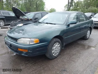 1996 Toyota Camry DX with VIN JT2BG12K5T0346311, listed as a IAAI auction lot 42130482 with 214,872 mi miles. Bid and sale history available at carsss.com. Image 2.
