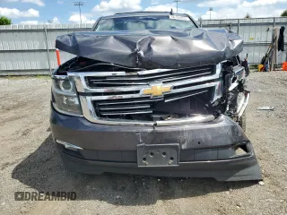 2015 Chevrolet Tahoe LTZ with VIN 1GNSKCKC9FR698924, listed as a Copart auction lot 56196895 with 184,740 mi miles and Salvage title. Bid and sale history available at DreamBid. Image 5.