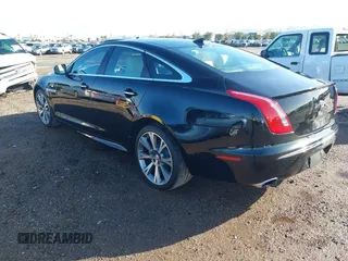 2015 Jaguar XJ with VIN SAJWA1CZ2F8V84677, listed as a IAAI auction lot 41723372 with 52,888 mi miles. Bid and sale history available at carsss.com. Image 3.
