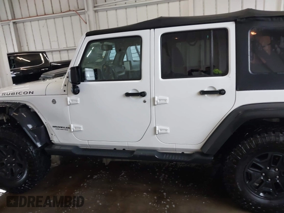 2016 Jeep Wrangler Unlimited Rubicon with VIN 1C4HJWFG4GL127379, listed as a IAAI auction lot 41732688 with 110,193 mi miles. Bid and sale history available at carsss.com. Image 14.